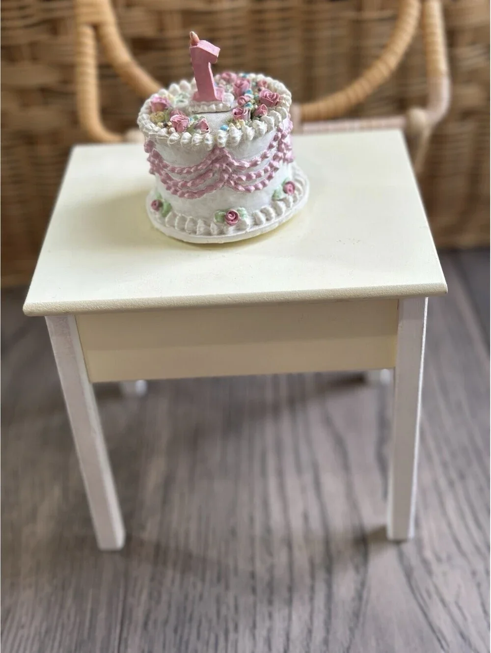 Musical vintage-style birthday cake features delicate pastel floral decorations